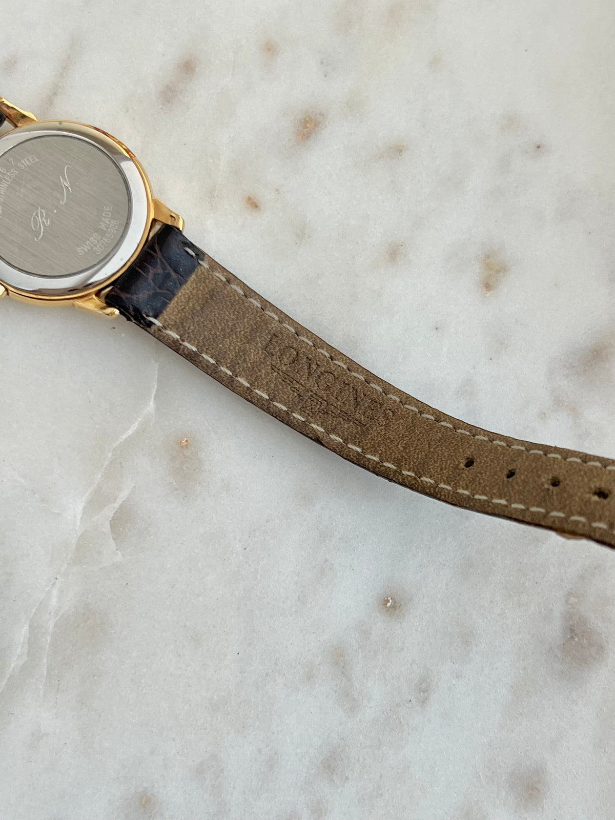 Longines Champagne Sunburst Dial Gold Watch: case back and strap underside detail.