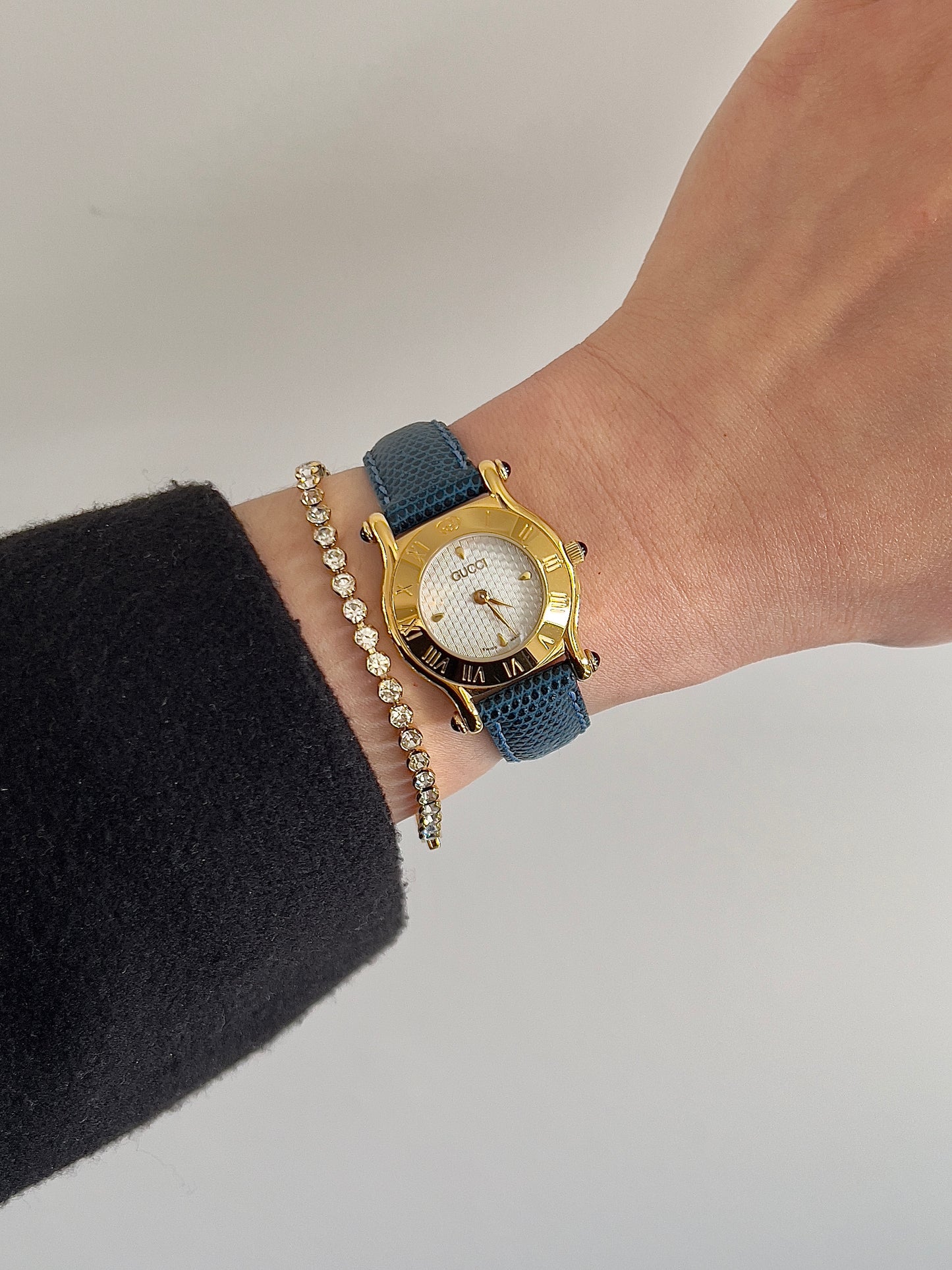 Gucci Gold Toned Ladies Watch with Roman Bezel and Textured Dial