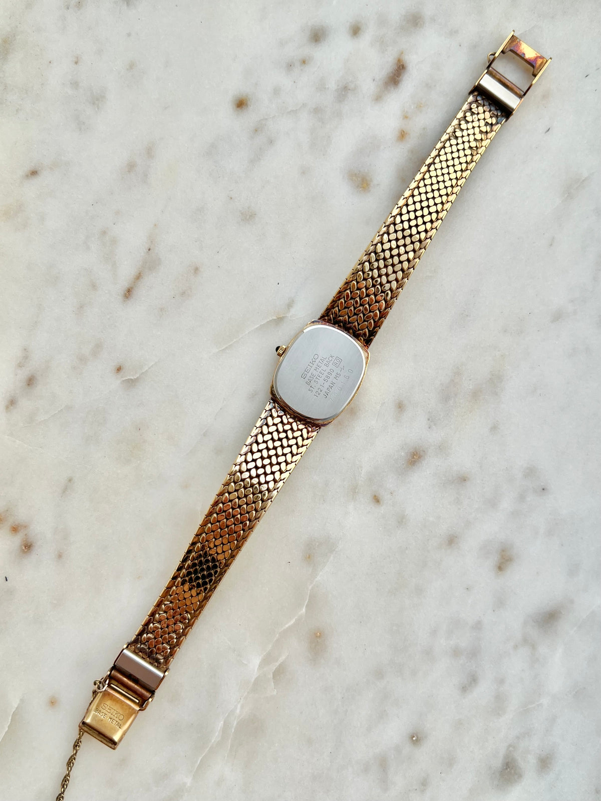 Seiko Exceline Gold Woven Watch: case back and bracelet underside.