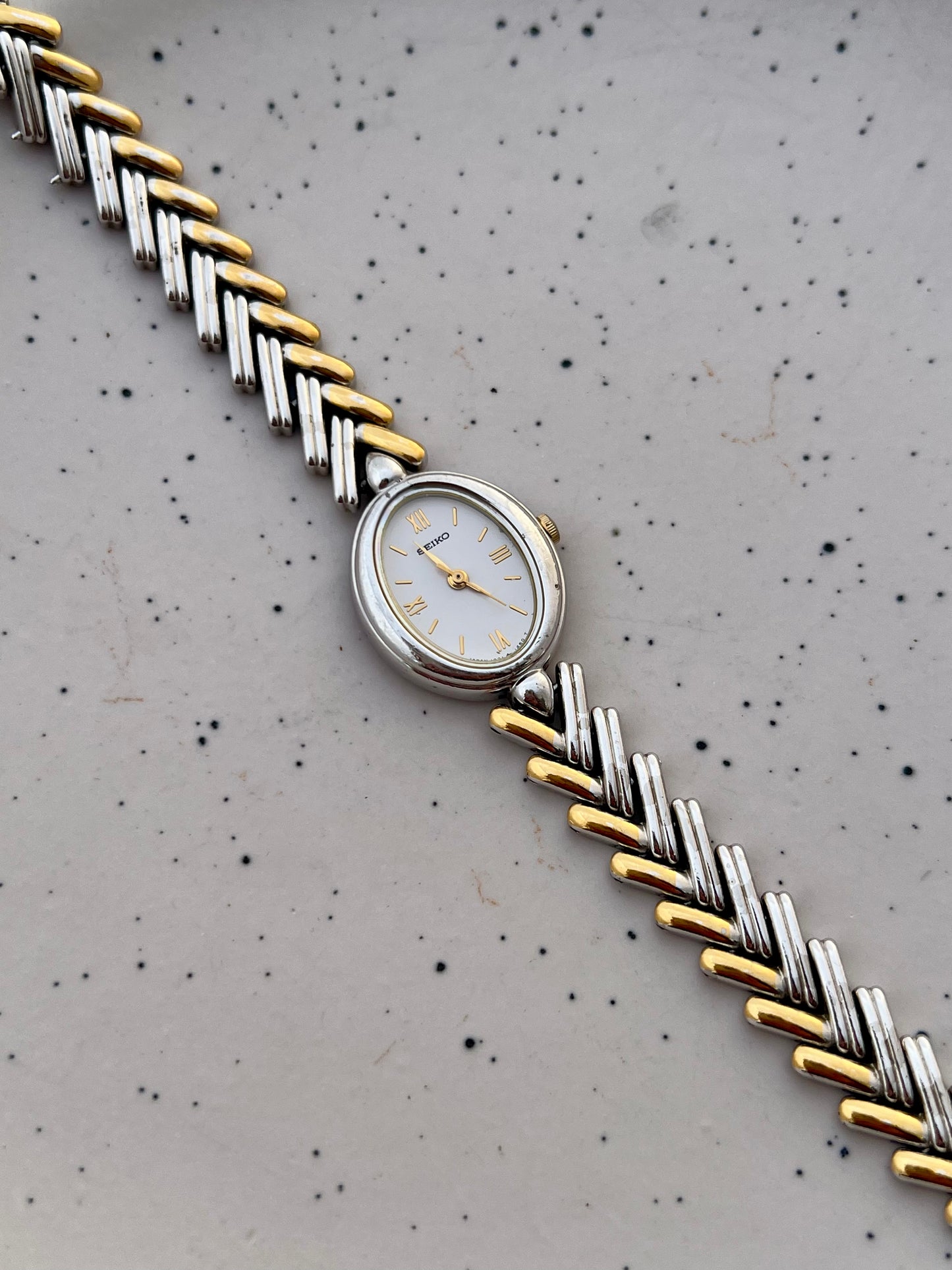 Seiko Ladies Two Tone Oval Herringbone Bracelet Watch
