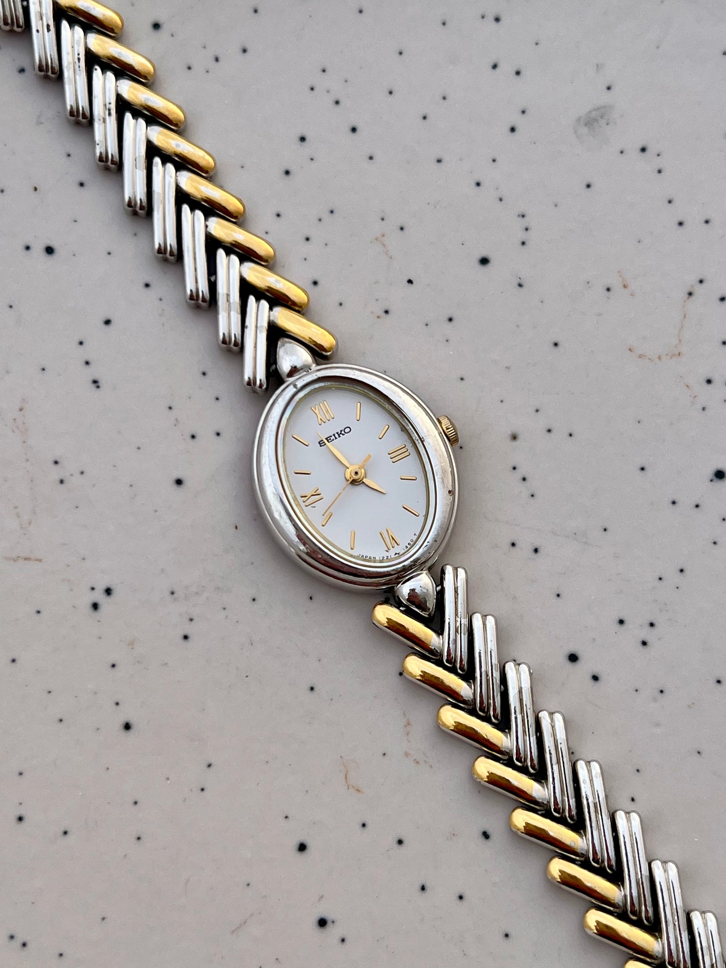 Seiko Ladies Two Tone Oval Herringbone Bracelet Watch