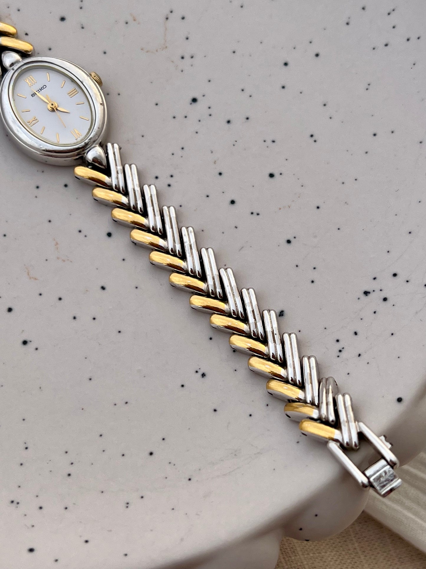 Seiko Ladies Two Tone Oval Herringbone Bracelet Watch