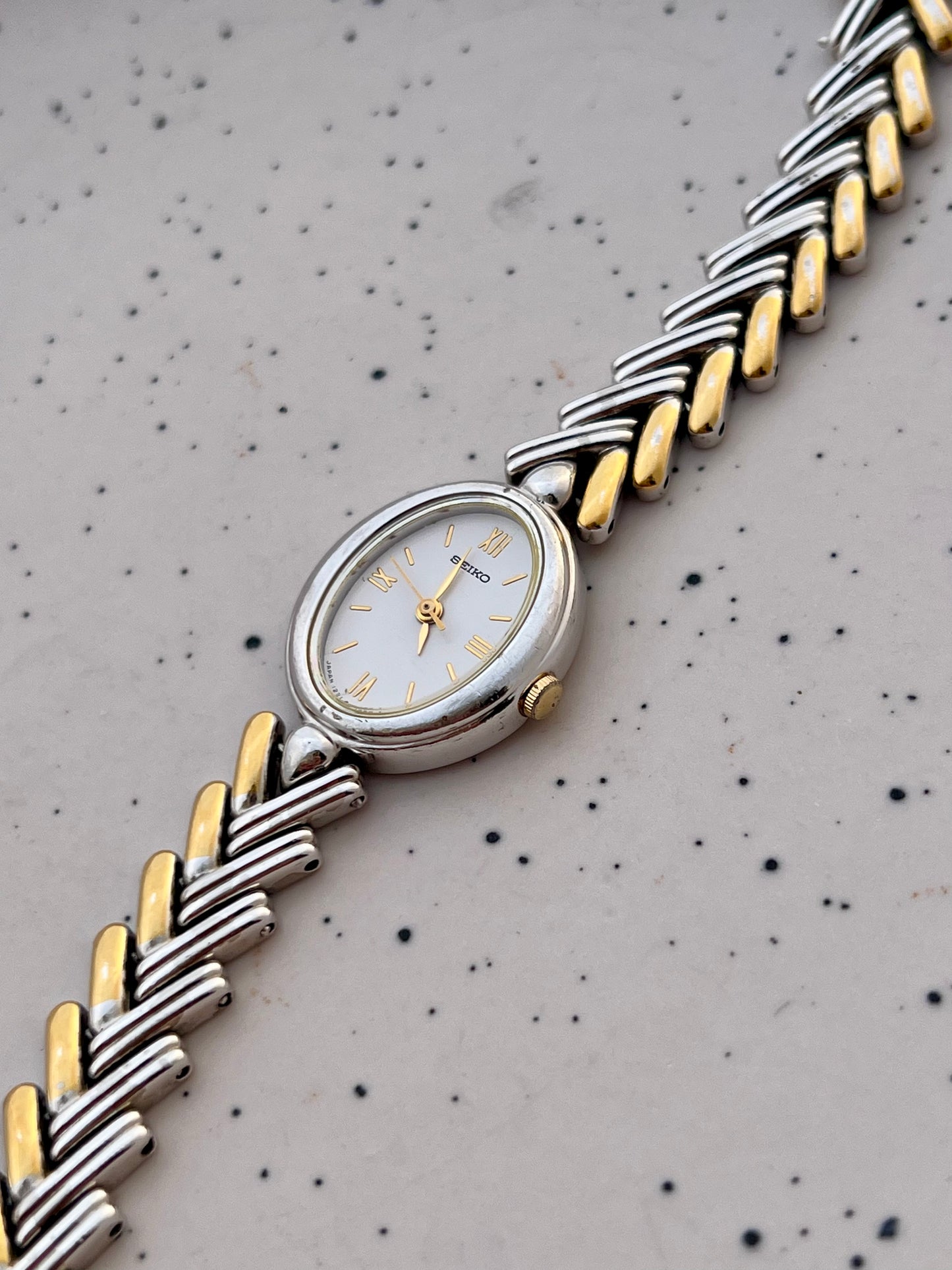 Seiko Ladies Two Tone Oval Herringbone Bracelet Watch