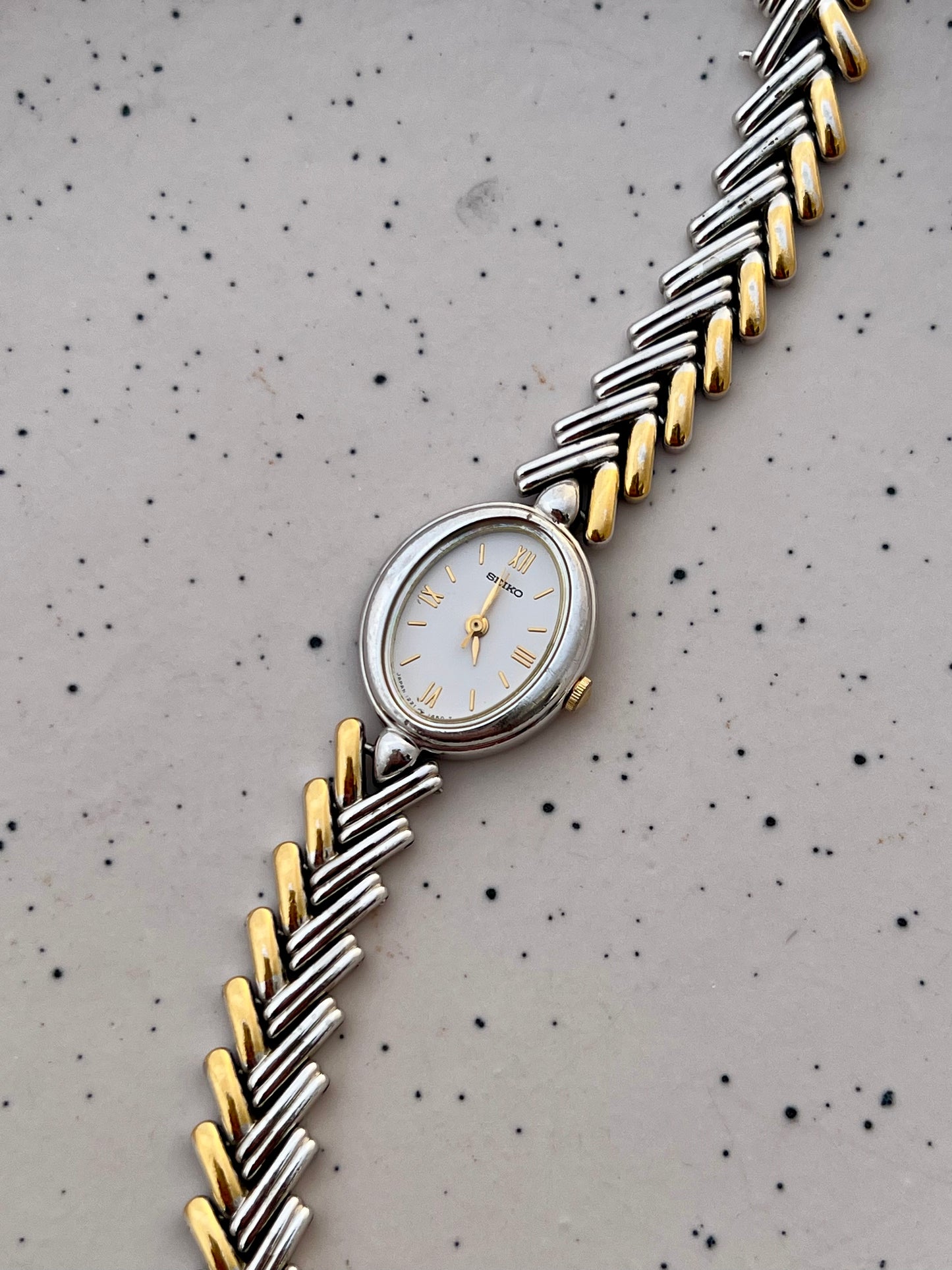 Seiko Ladies Two Tone Oval Herringbone Bracelet Watch