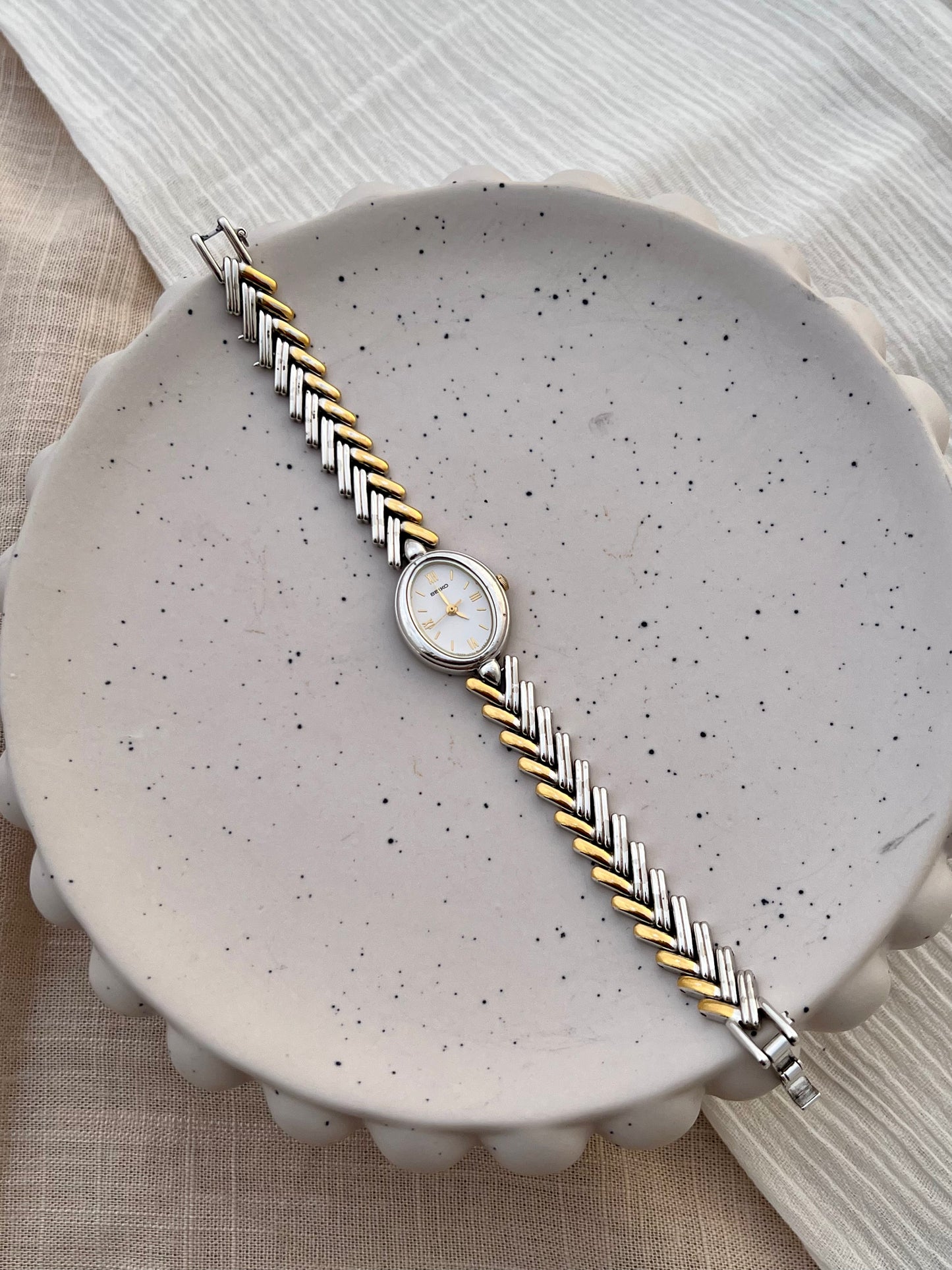 Seiko Ladies Two Tone Oval Herringbone Bracelet Watch