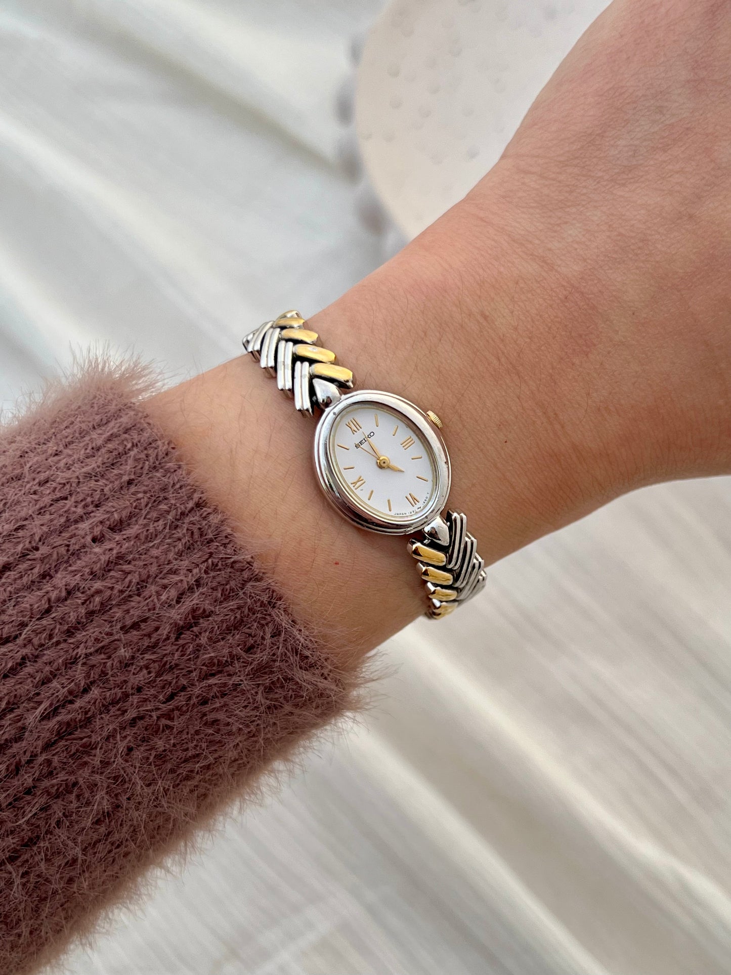 Seiko Ladies Two Tone Oval Herringbone Bracelet Watch