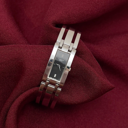 Silver Seiko Woman's watch on a maroon fabric background