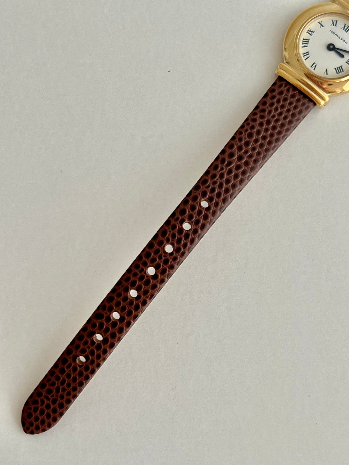 Hamilton Gold Round Women's Watch with Double Bar Lugs, front view of a vintage women's watch at Gilded Hour.