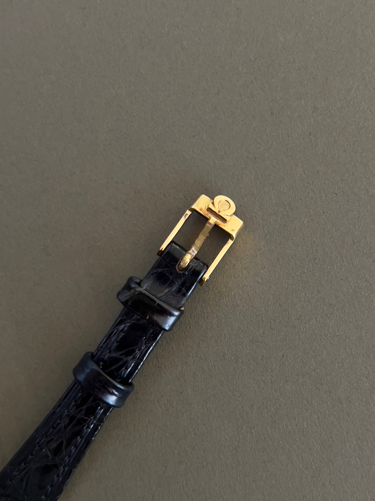 Omega De Ville Cushion Case Woman's Watch, caseback detail of a vintage women's watch at Gilded Hour.