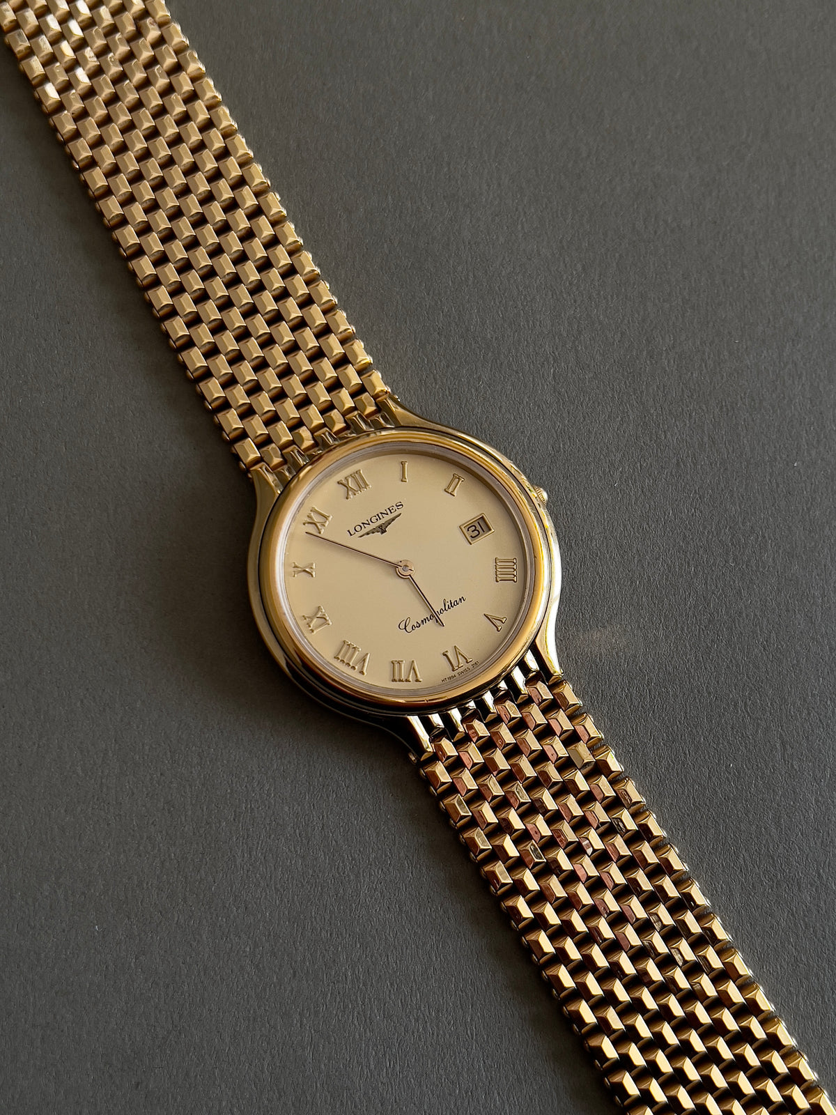 Longines Cosmopolitan Unisex Gold Toned Watch with Sculpted Mesh Bracelet, dial close up of a vintage women's watch at Gilded Hour.