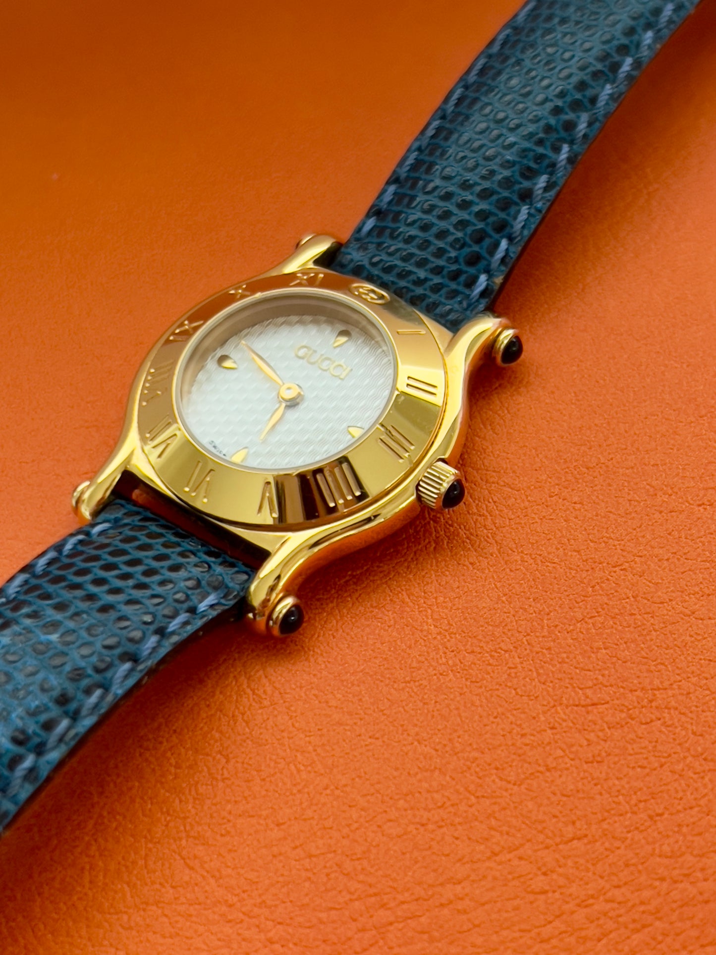 Gucci Gold Toned Ladies Watch with Roman Bezel and Textured Dial