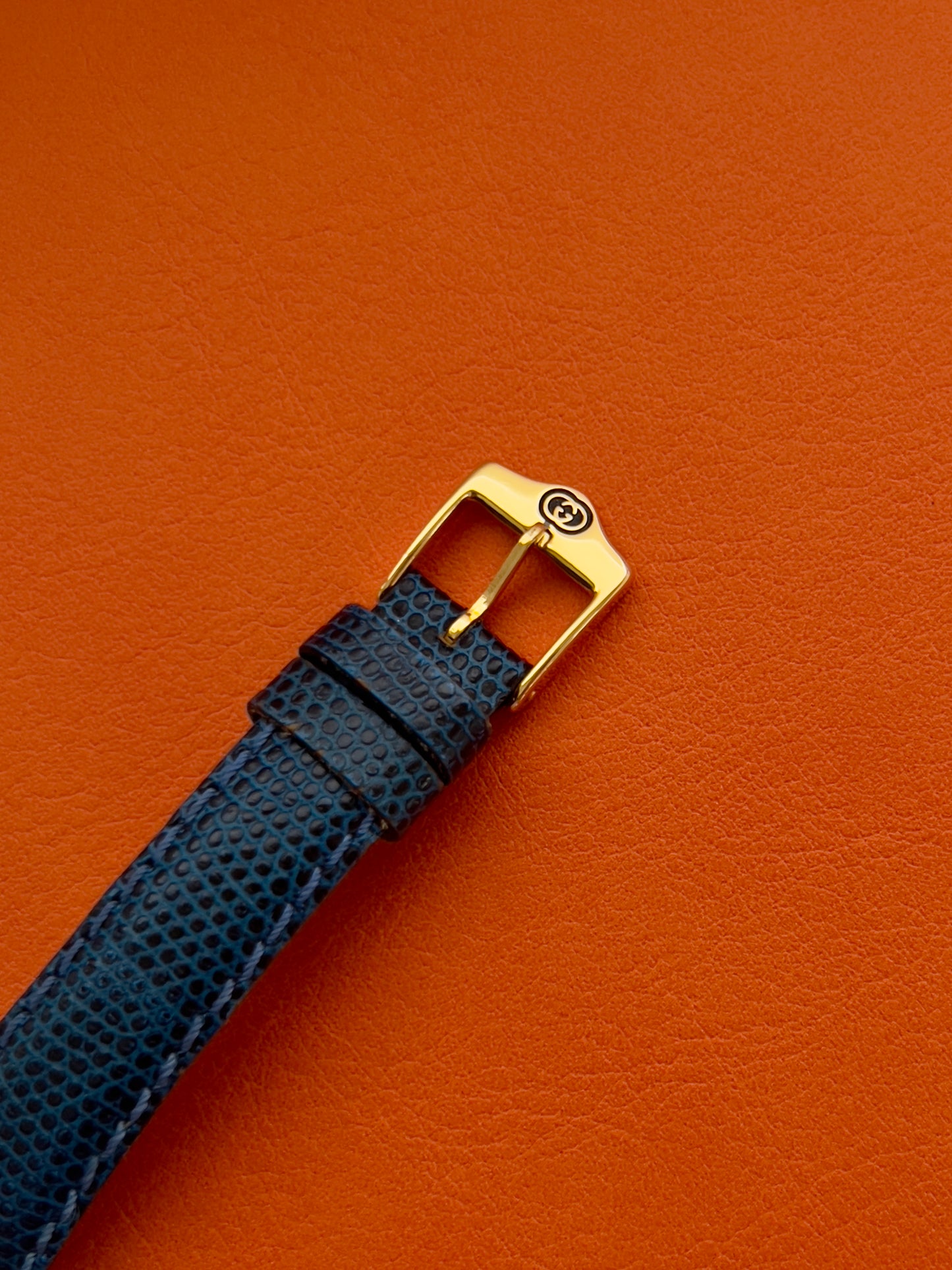 Gucci Gold Toned Ladies Watch with Roman Bezel and Textured Dial