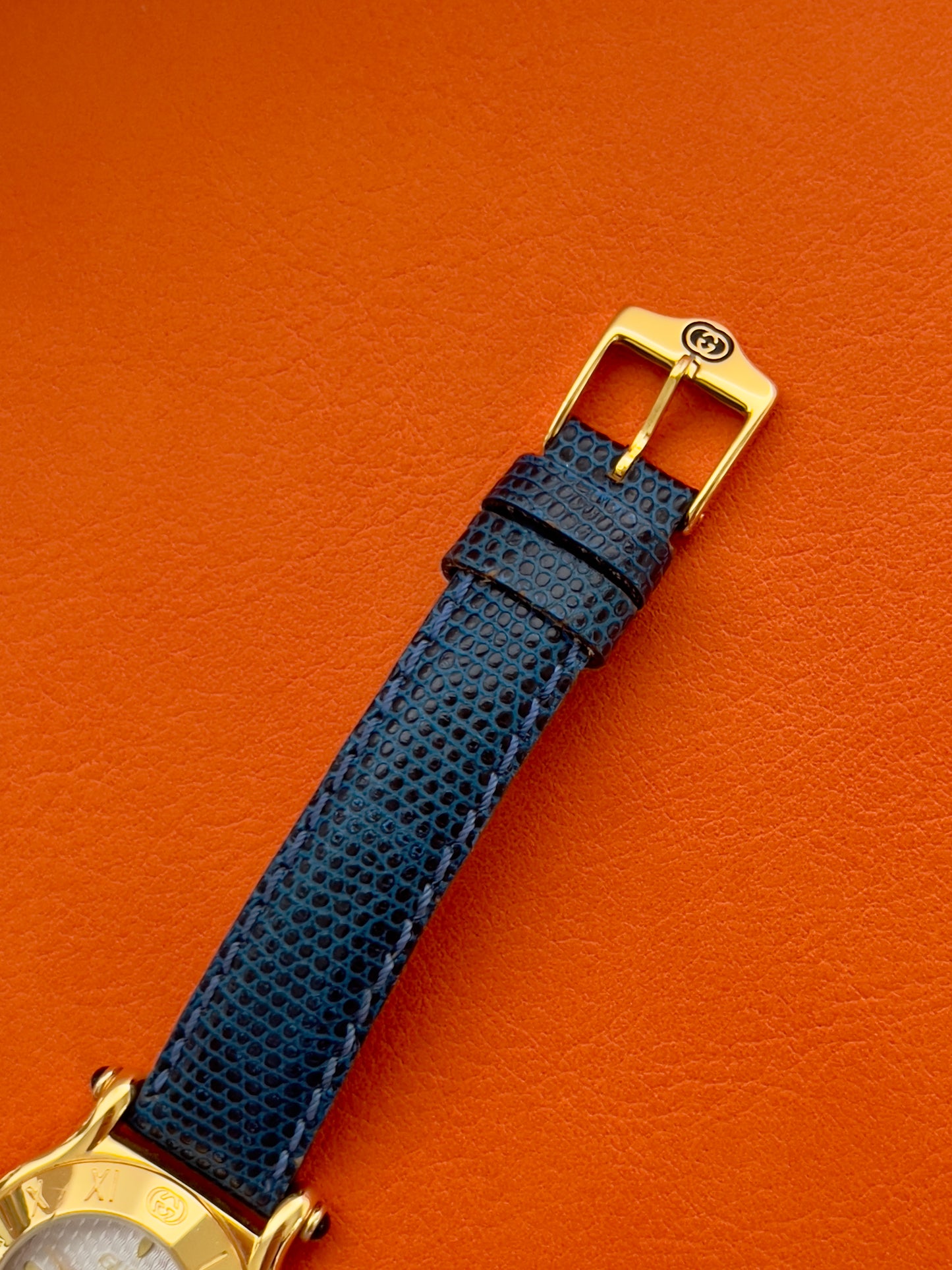 Gucci Gold Toned Ladies Watch with Roman Bezel and Textured Dial