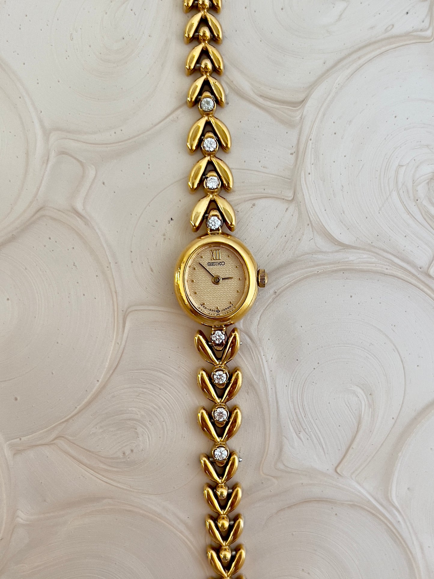 Seiko Ladies Gold Tennis Bracelet Watch with Diamond Accents and Champagne Dial