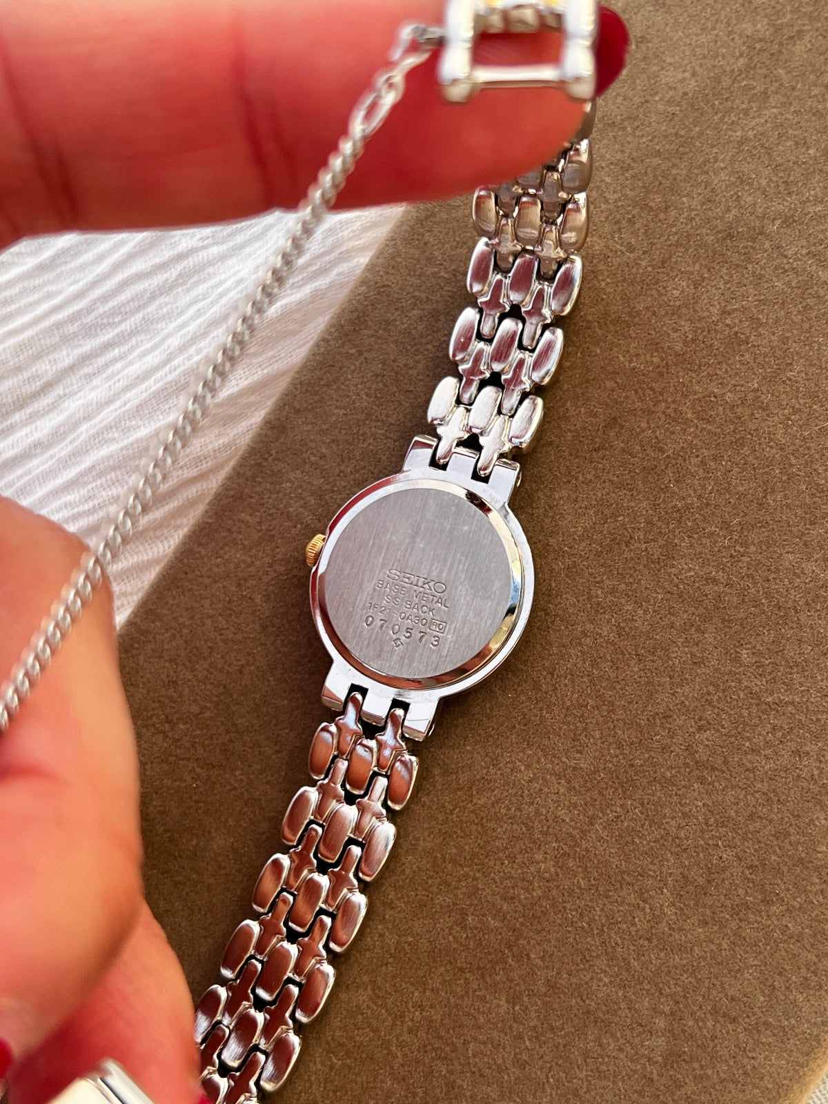 Seiko vintage ladies dress watch with two-tone gold and silver bracelet, white Roman numeral dial, and spade hands – classic quartz timepiece from Gilded Hour NZ.
