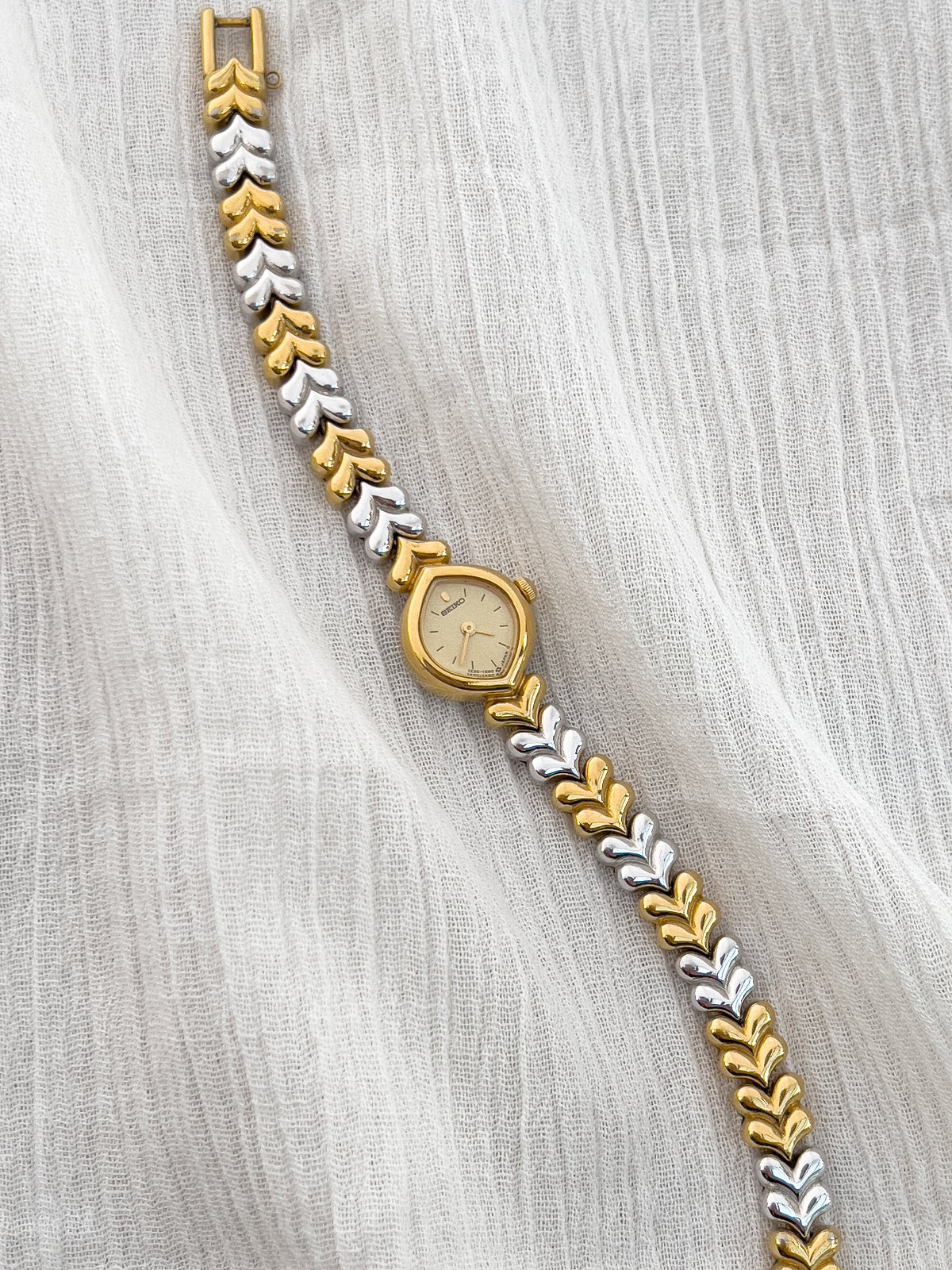 Vintage Seiko ladies’ watch with gold-tone teardrop case and silver-gold leaf link bracelet – elegant petite women’s quartz watch from Gilded Hour NZ.