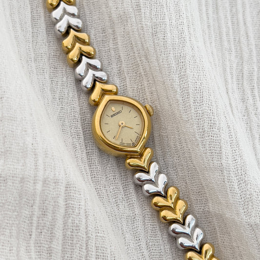 Vintage Seiko ladies’ watch with gold-tone teardrop case and silver-gold leaf link bracelet – elegant petite women’s quartz watch from Gilded Hour NZ.