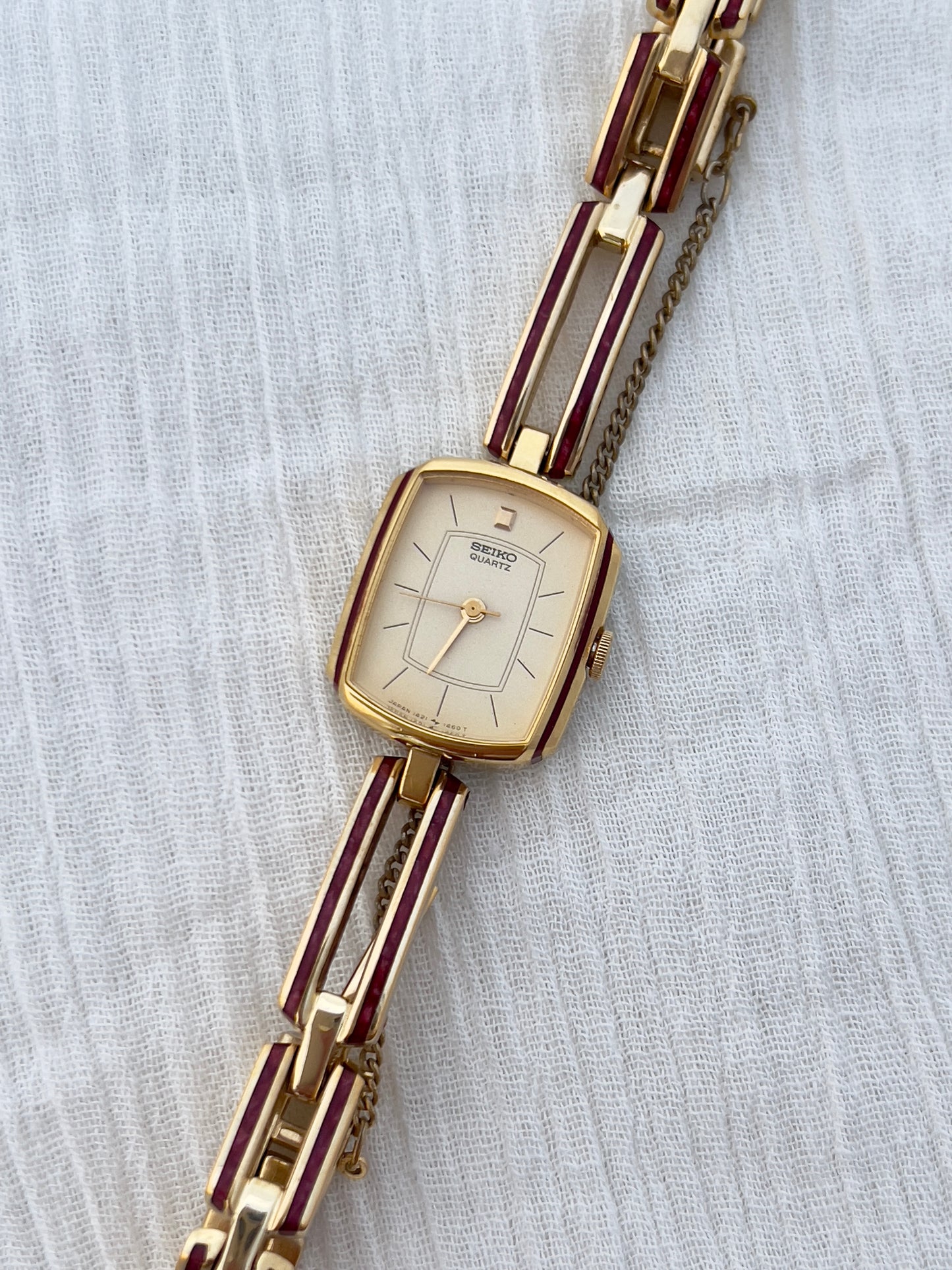 Seiko Ladies Gold Bracelet Watch with Crimson Enamel Accents