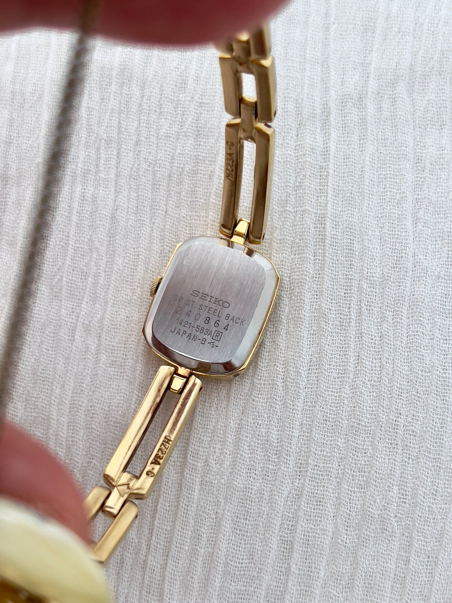 Seiko Ladies Gold Bracelet Watch with Crimson Enamel Accents