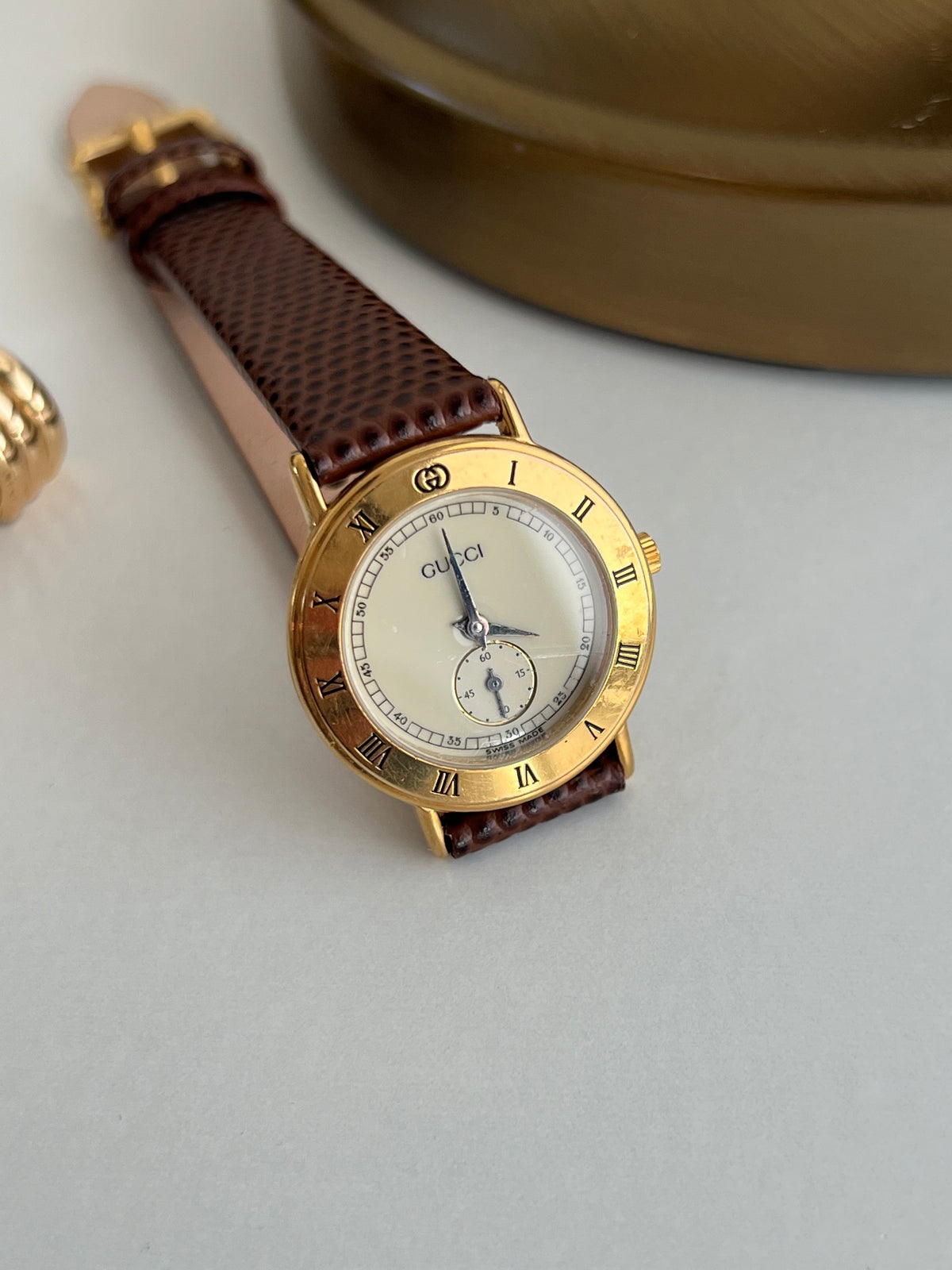 Gucci Roman Bezel Cream Dial Women’s Watch, caseback detail of a vintage women's watch at Gilded Hour.