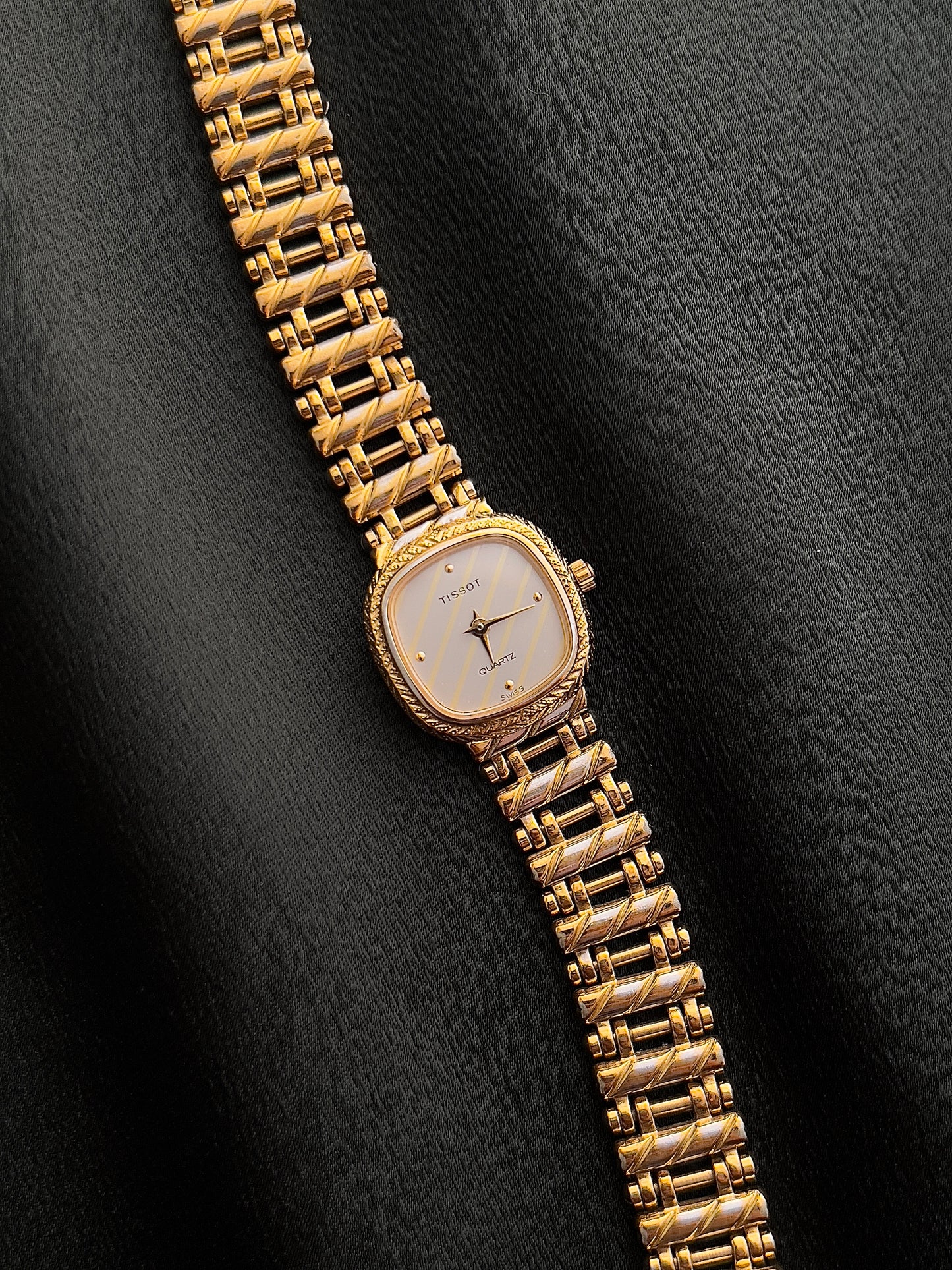Tissot Ladies Gold Watch with Textured Bracelet and Striped Dial