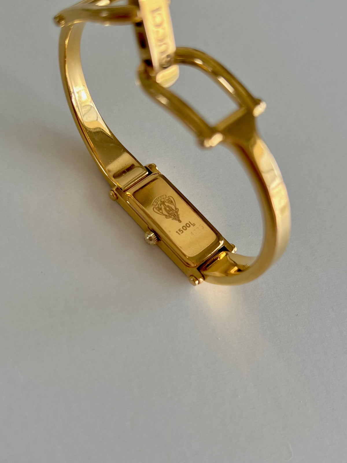 Gucci 1500 Gold Bangle Women’s Watch Ivory Dial, dial close up of a vintage women's watch at Gilded Hour.