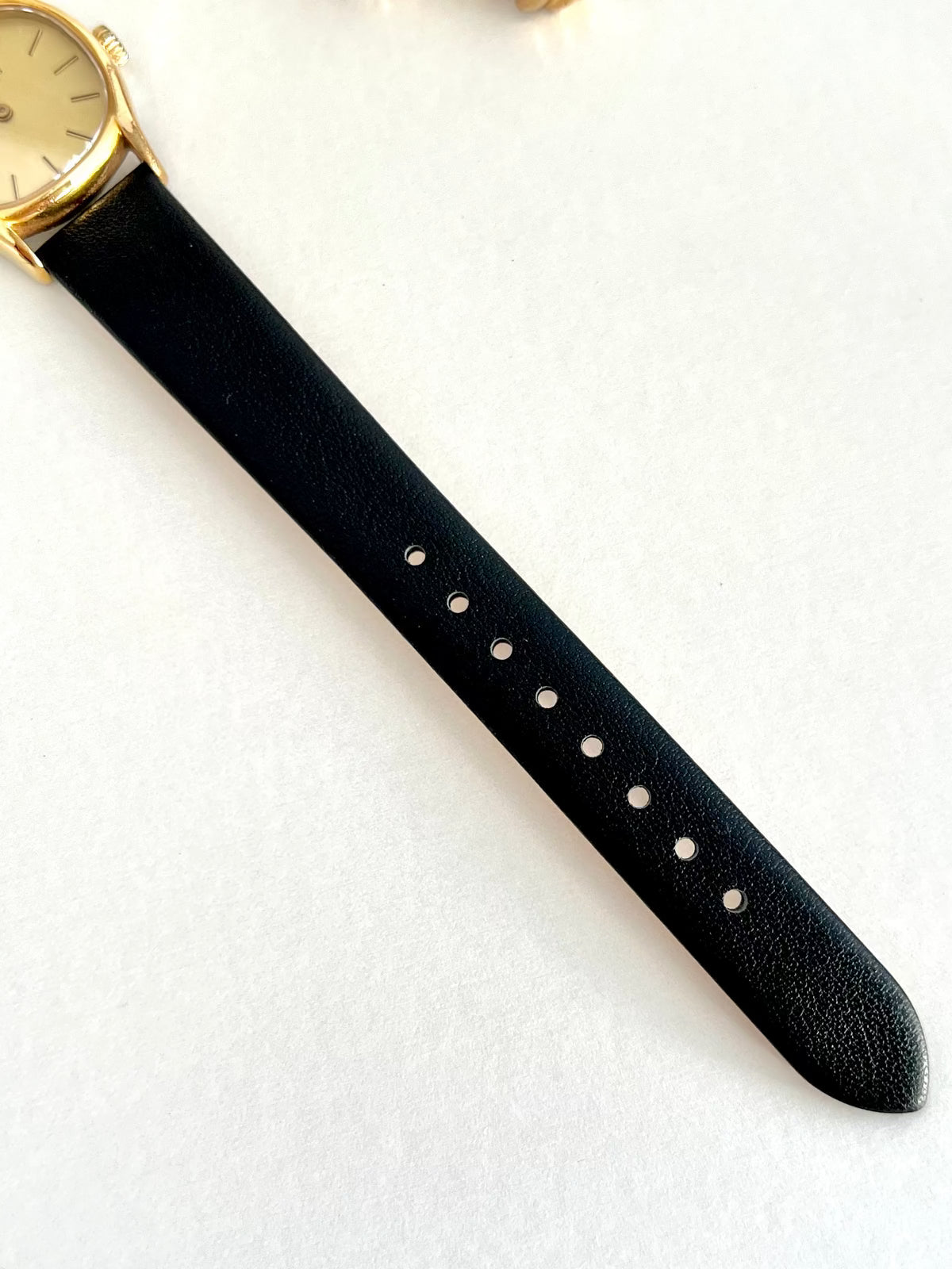 Longines Gold Tone Cushion Case Women’s Watch, caseback detail of a vintage women's watch at Gilded Hour.