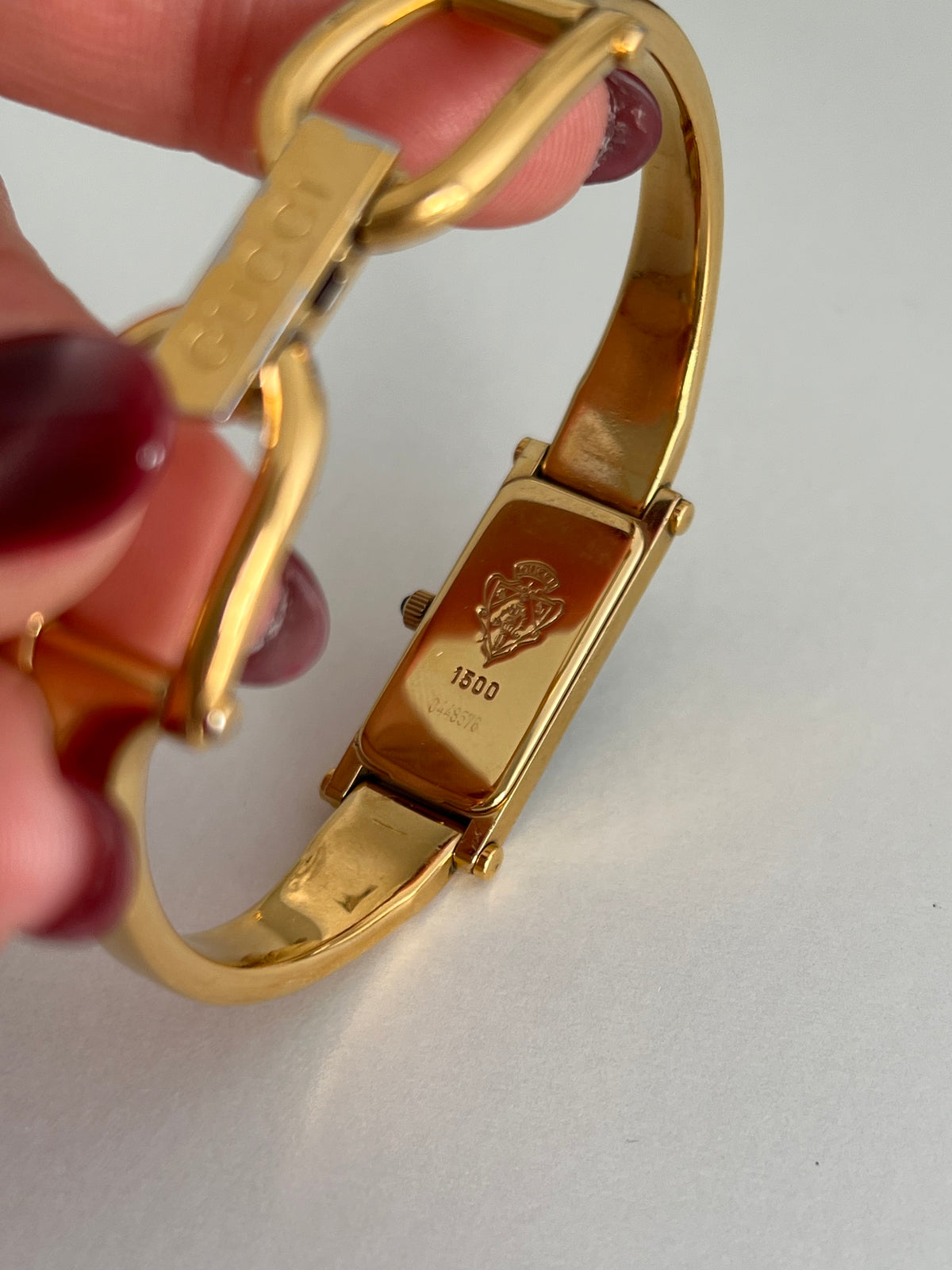 Gucci 1500 Gold Bangle Women’s Watch Black Dial, wrist shot of a vintage women's watch at Gilded Hour.