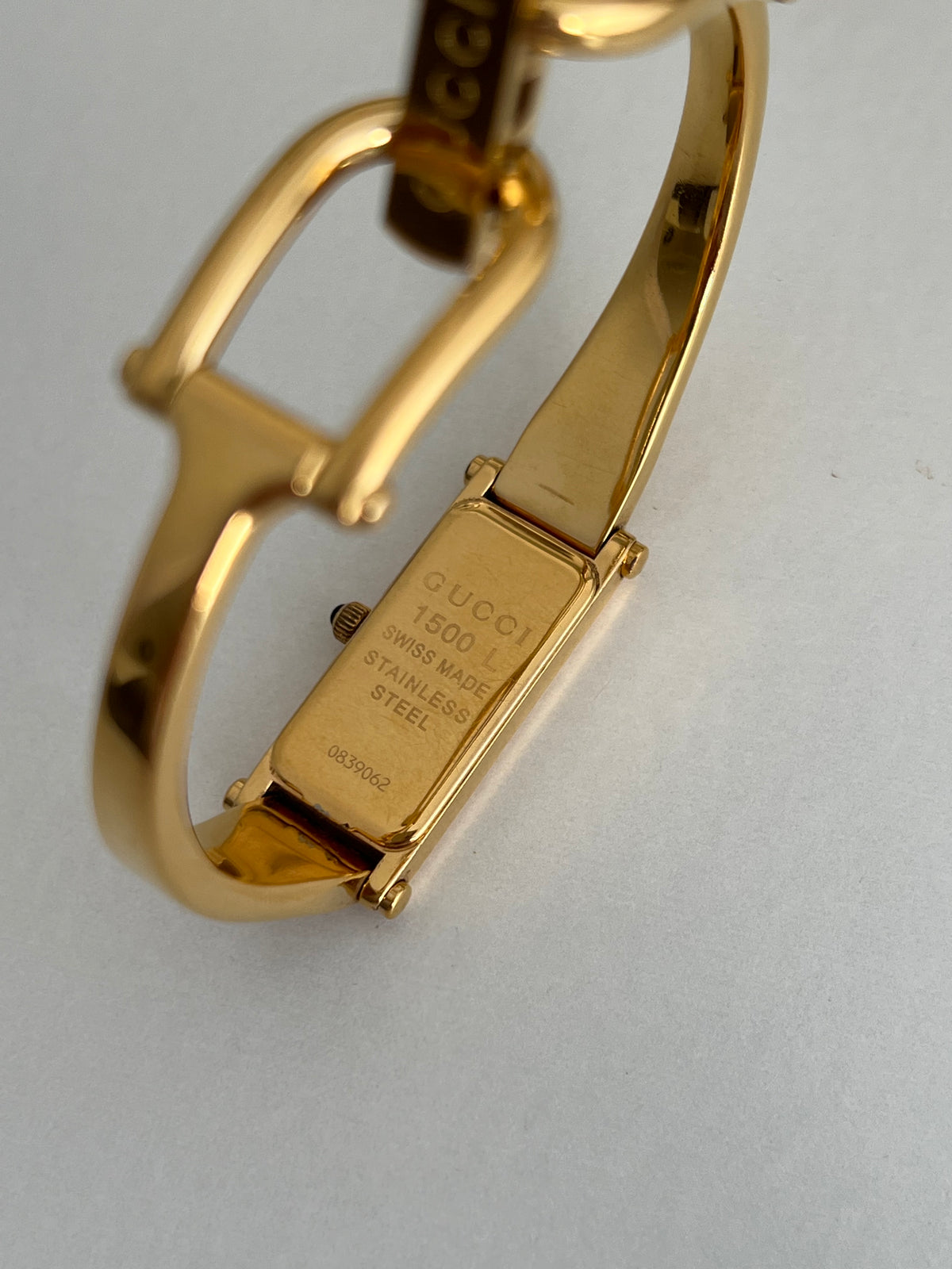 Gucci 1500L Gold Bangle Women’s Watch Champagne Dial, case profile of a vintage women's watch at Gilded Hour.