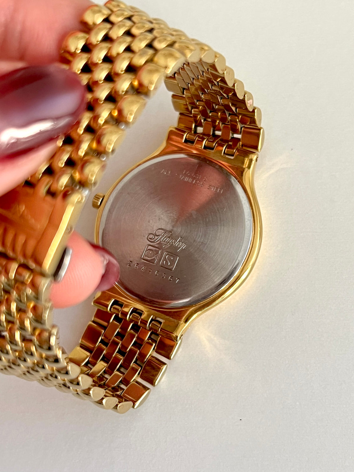 Longines Flagship Round Unisex Watch with Date Window, caseback detail of a vintage women's watch at Gilded Hour.