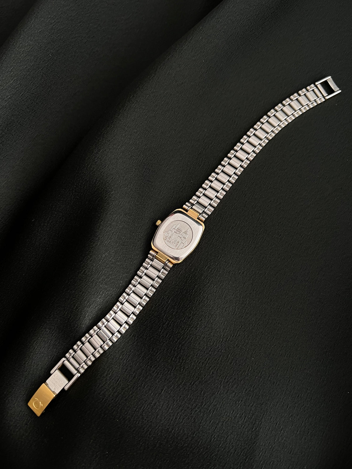 Omega De Ville Gold Tonneau Watch: full bracelet underside view.