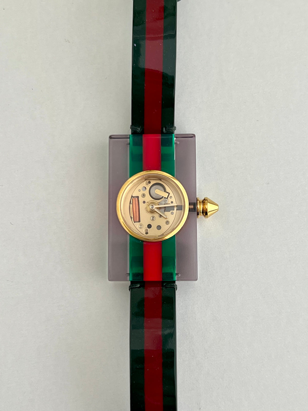 Gucci Skeleton Web Plexiglass Bangle Watch, front view of a vintage women's watch at Gilded Hour.