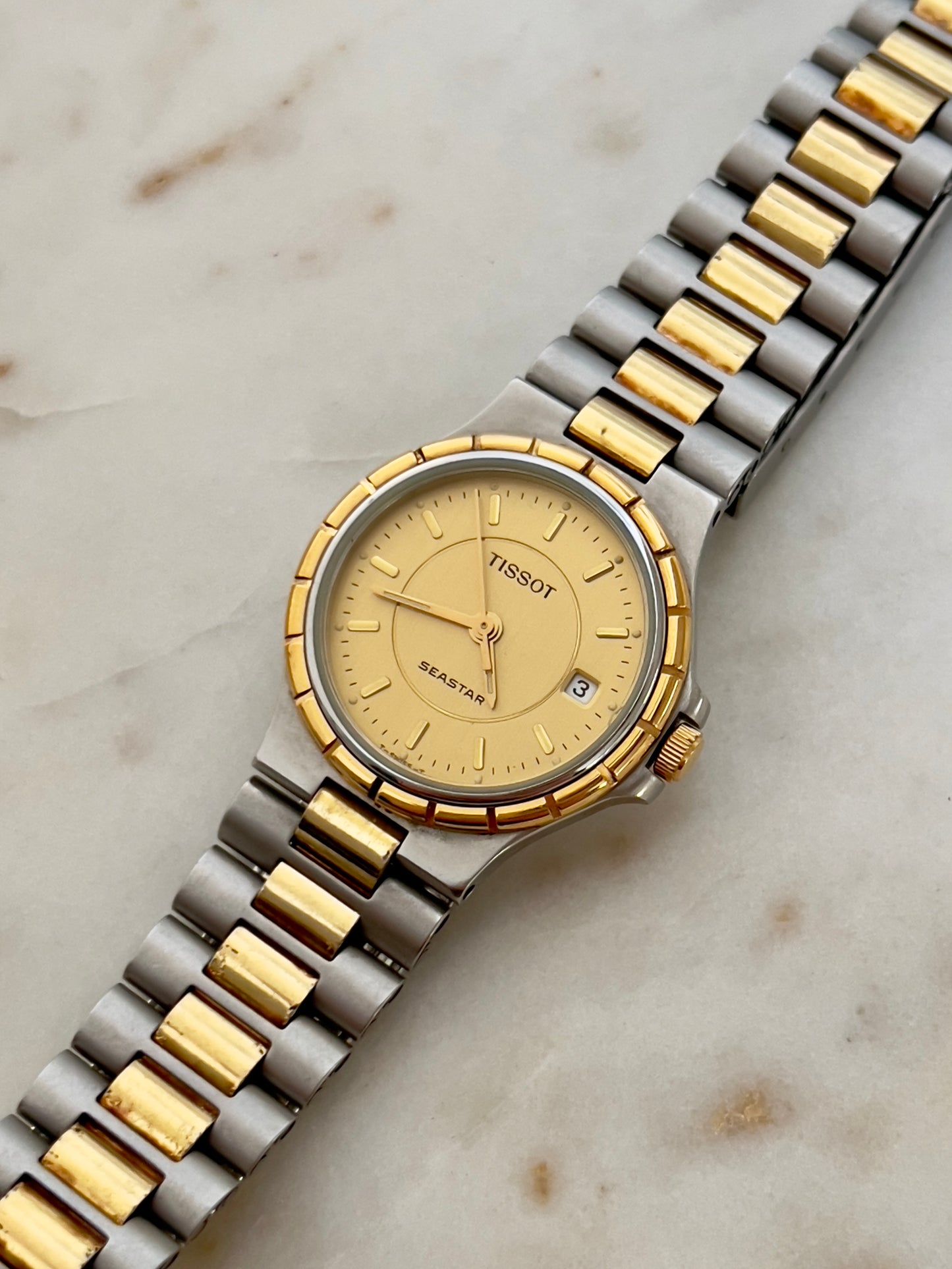 Tissot Seastar Two-Tone Watch with Sunburst Gold Dial and Date