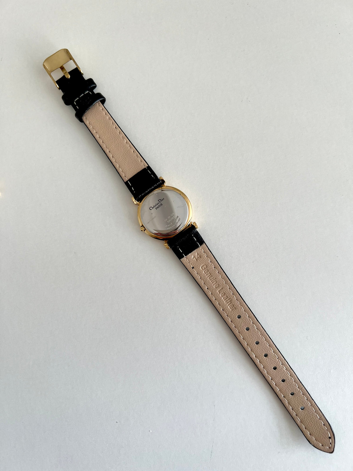 Christian Dior Gold Dress Watch with Black Strap, dial close up of a vintage women's watch at Gilded Hour.