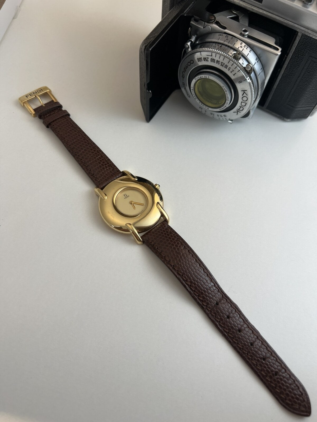 Fendi 400G with its full original brown textured strap and Fendi signed gold tone buckle.