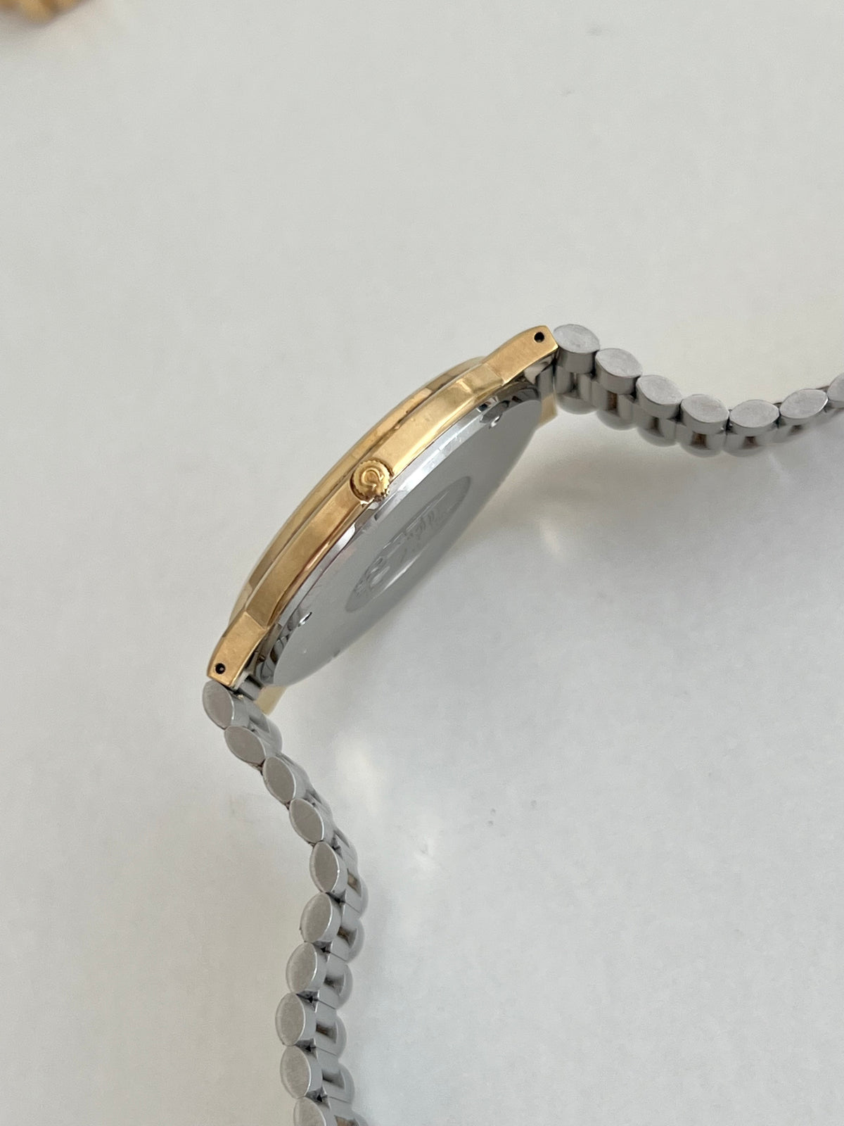 Omega De Ville Gold Tone Unisex Watch with Integrated Bracelet, bracelet detail of a vintage women's watch at Gilded Hour.