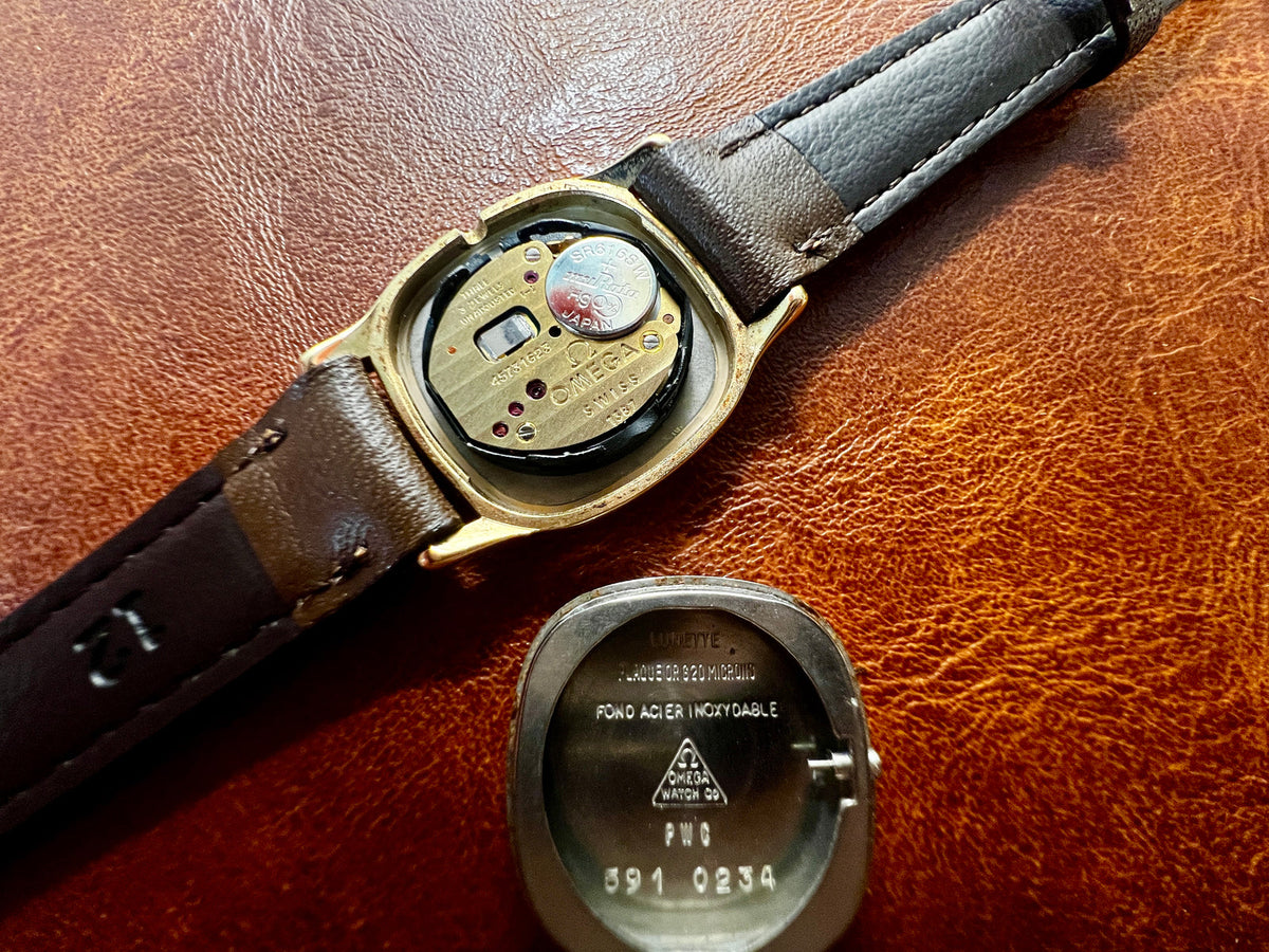 Omega De Ville Cushion Case Woman's Watch with Rope Bezel Pattern, angled view of a vintage women's watch at Gilded Hour.