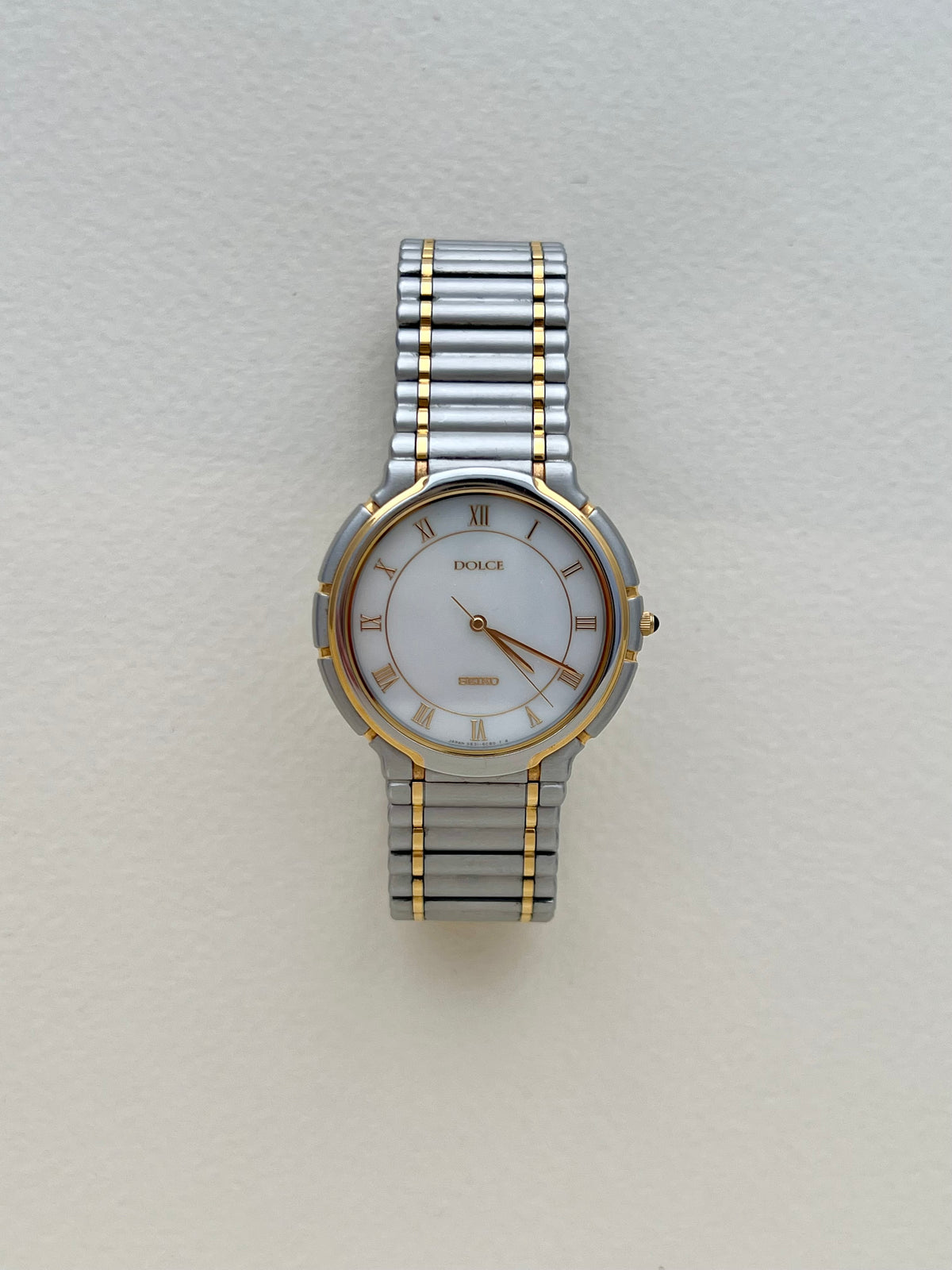 Seiko Dolce two-tone mother-of-pearl ladies watch, case profile.