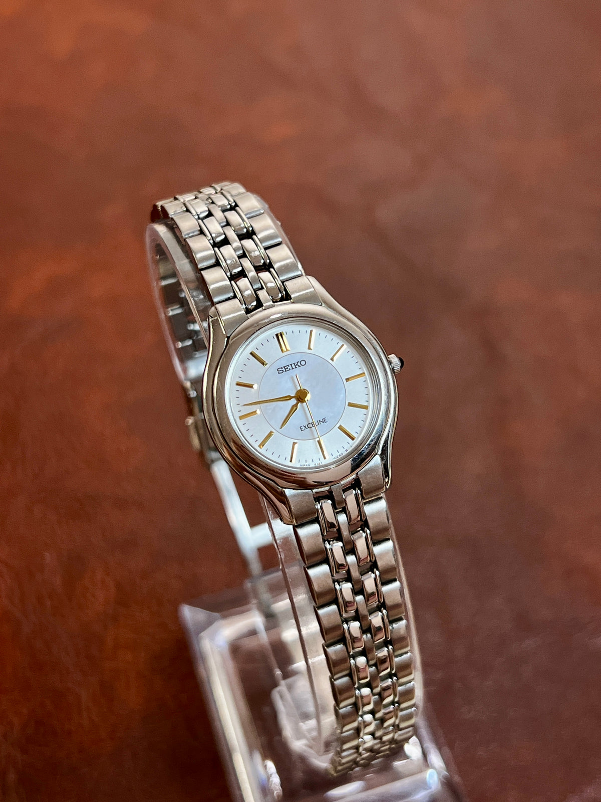 Seiko Exceline pale blue dial watch with gold hands and a silver bracelet, product photograph 3.