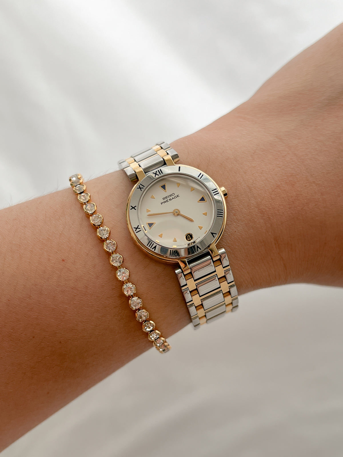 Seiko Presage Roman Bezel Two Tone Women’s Watch featuring silver sunray dial and integrated two tone bracelet; vintage watch product image 5.