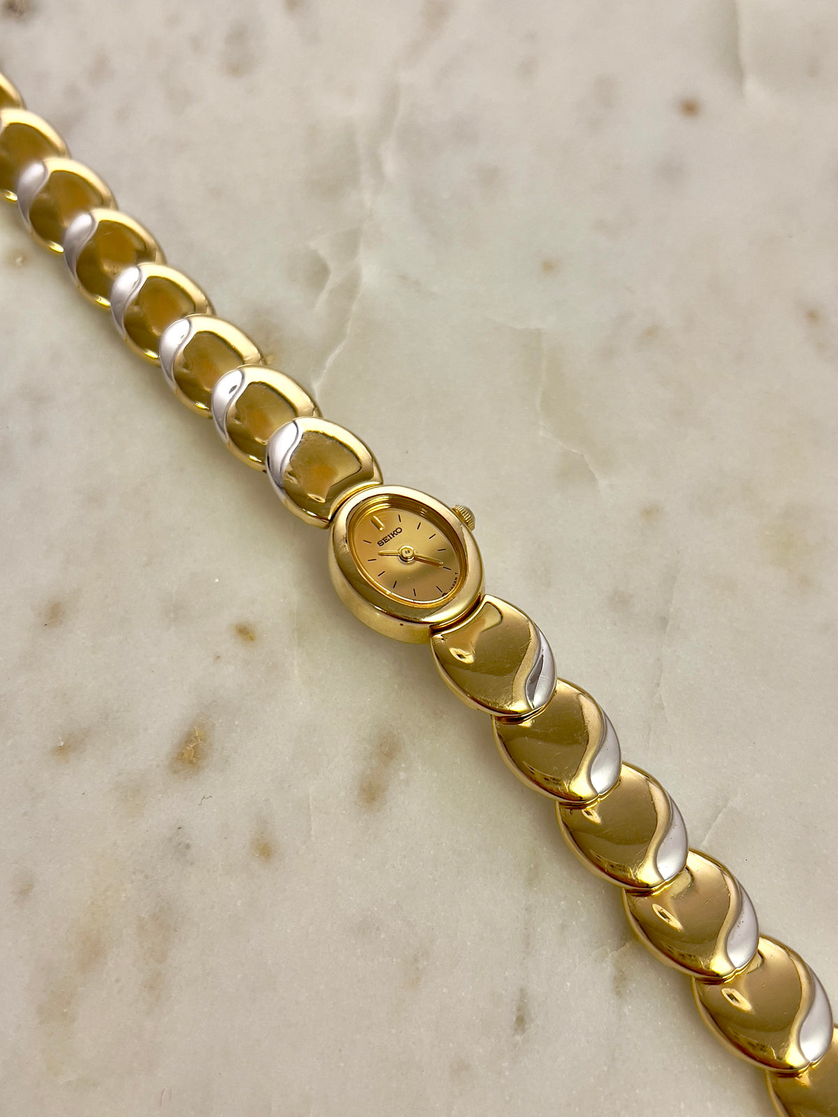 Seiko Tisse Oval Sculpted Two Tone Women's Watch — product photograph 10, Gilded Hour NZ.