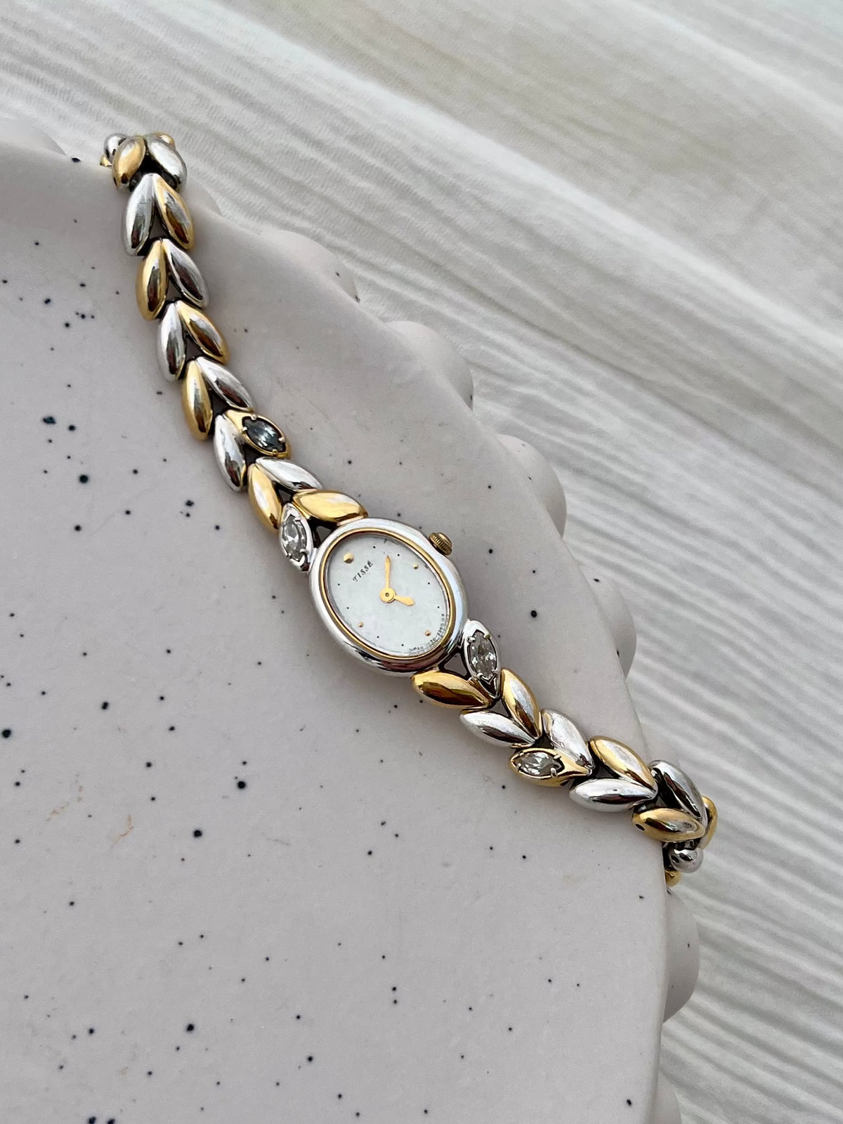Seiko two-tone oval gemstone bracelet watch with its presentation box.