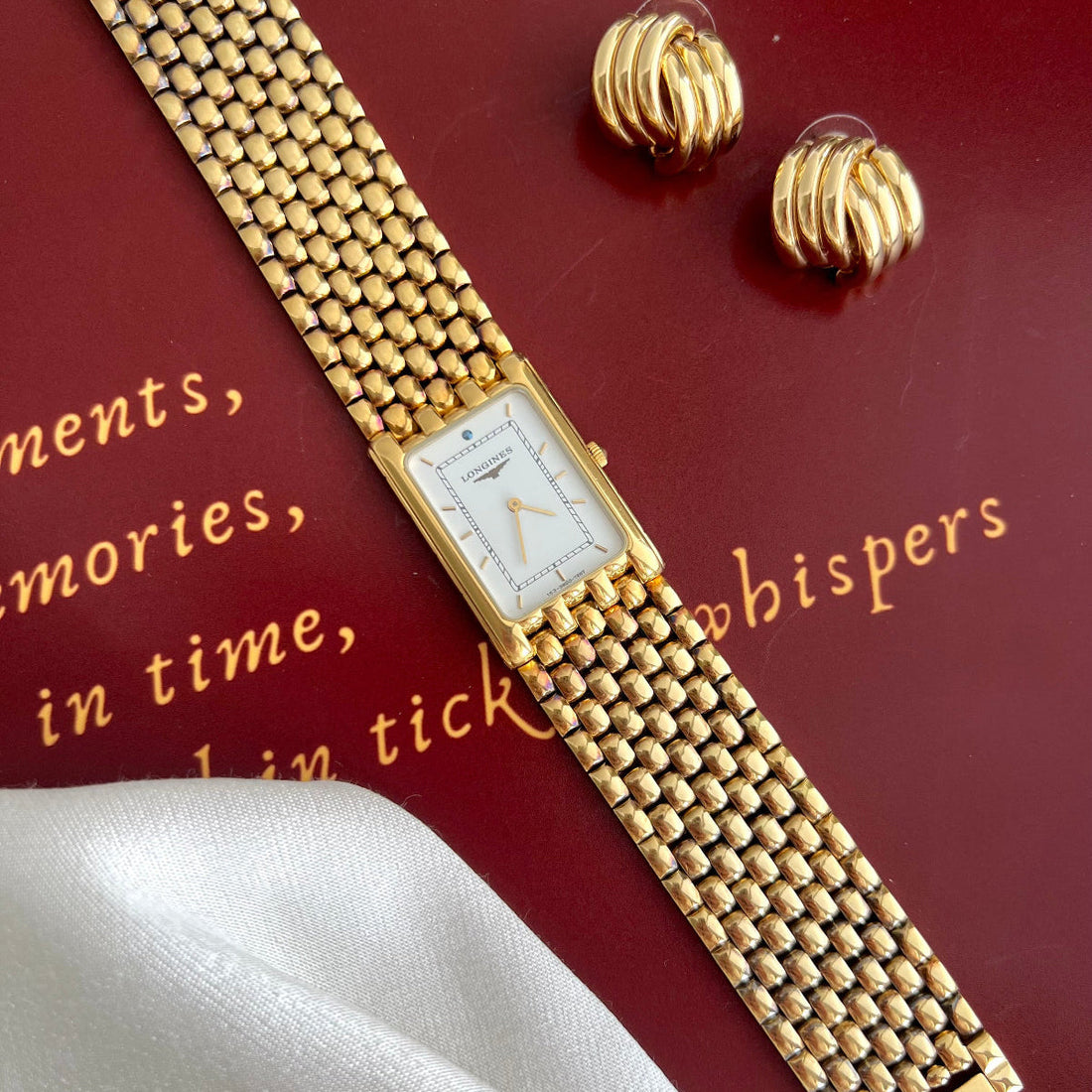 Longines Flagship white dial rice bracelet watch styled for soft white spring tailoring