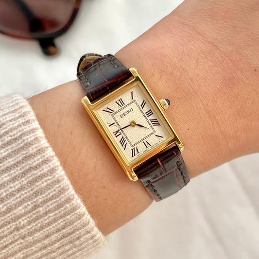 Seiko x Nano Universe rectangular women’s watch styled with sunglasses and gold jewellery