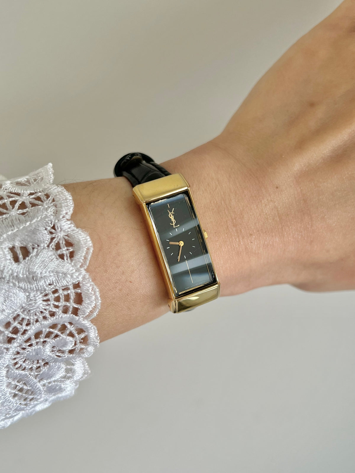 Yves Saint Laurent Black Dial Elongated Gold Tank Women’s Watch