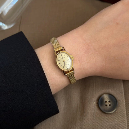 Omega De Ville Oval Champagne Dial Cocktail Women’s Watch worn on the wrist