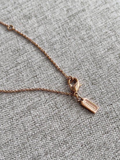 Coach Lucky Clover Rose Gold Tone Necklace