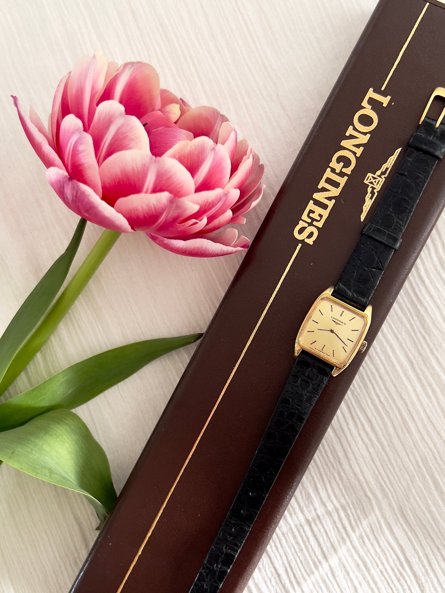 Longines Gold Tonneau Ladies Watch with Golden Dial and Black Leather Strap