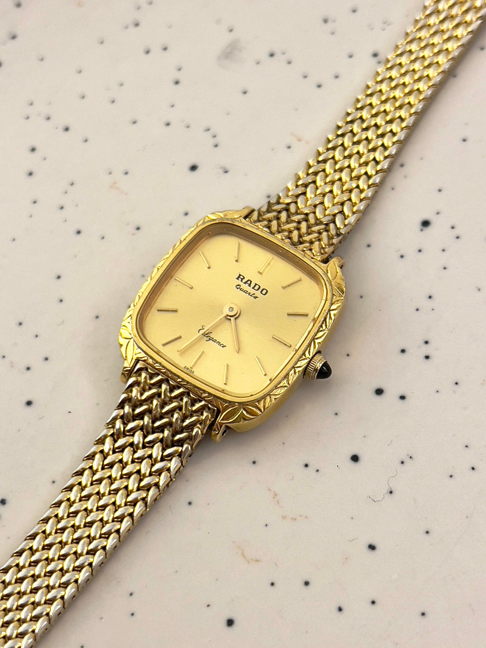 Slim profile of gold-tone Rado Elegance women's watch – dainty and timeless vintage design
