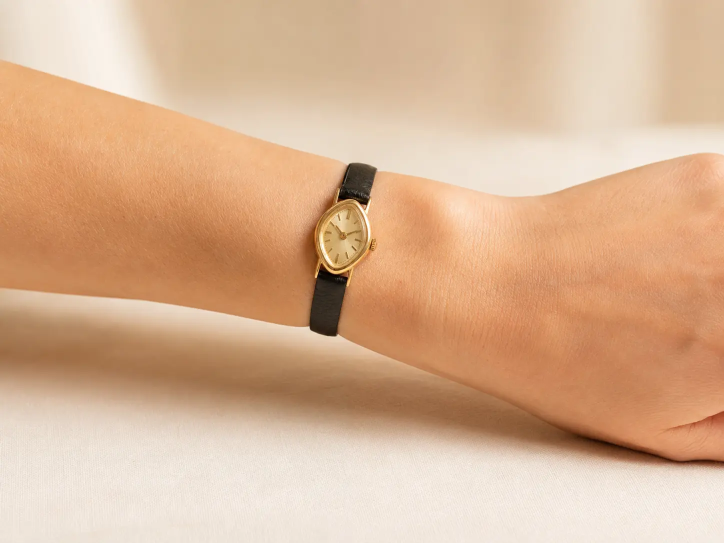 Petite vintage watch fitted comfortably just above the wrist bone